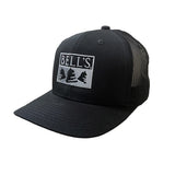 Black baseball cap with twill front and mesh back. Features silver Bell's embroidered logo on the front.