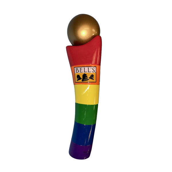 Beer tap handle with rainbow colored stripes (red at the top, orange, yellow, green, blue, purple) and a gold sphere on top. Bell's logo featured on orange stripe.
