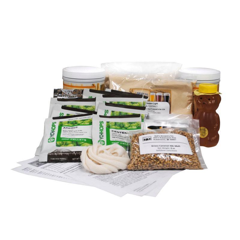 Ingredients from homebrewing extract kit, including hops, malt, honey, malt extract and recipes