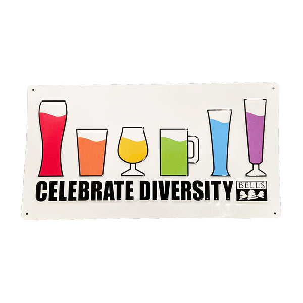White rectangle tin sign with six beer glasses filled with liquids of rainbow colors, including (Left to Right), red, orange, yellow, green, blue, purple. "Celebrate Diversity" and Bell's logo below in black.